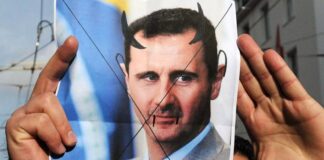 Assad fugge da Damasco a Mosca, arsenale chimico ai “ribelli”, Israele già attivo, Russia e Iran senza basi: Medio Oriente più in fiamme? Ritratto di Assad in mano ai ribelli (Fotogramma - Ipa da Adnkronos)