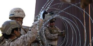 Usa, 1.200 migranti arrestati in un giorno. Trump: “In catene assassini e signori droga”